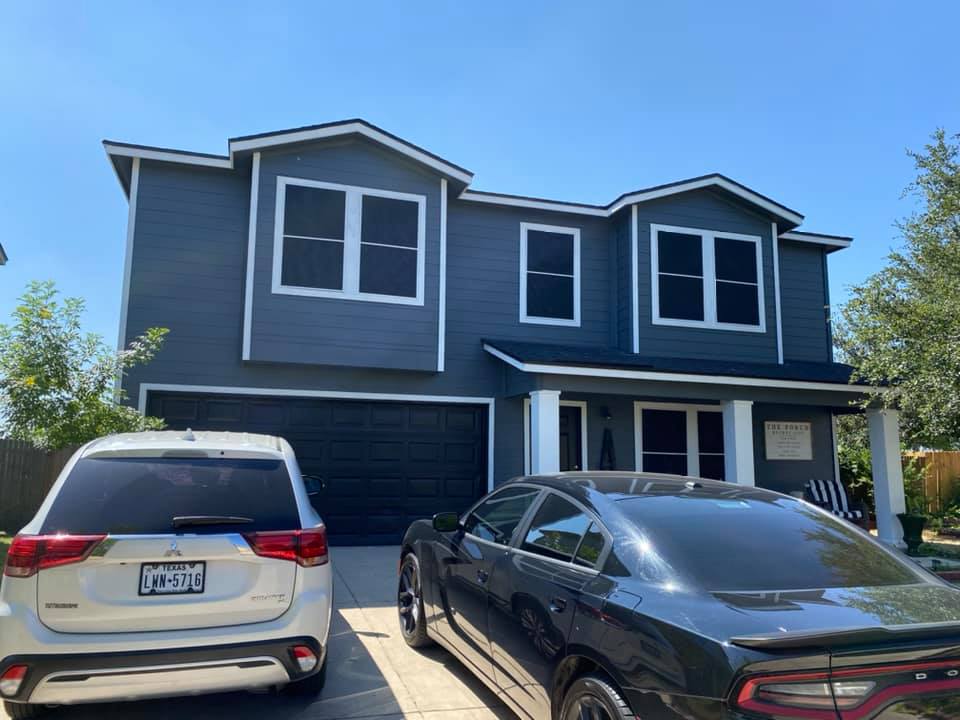 Two-story home with solar screens installed on every window
